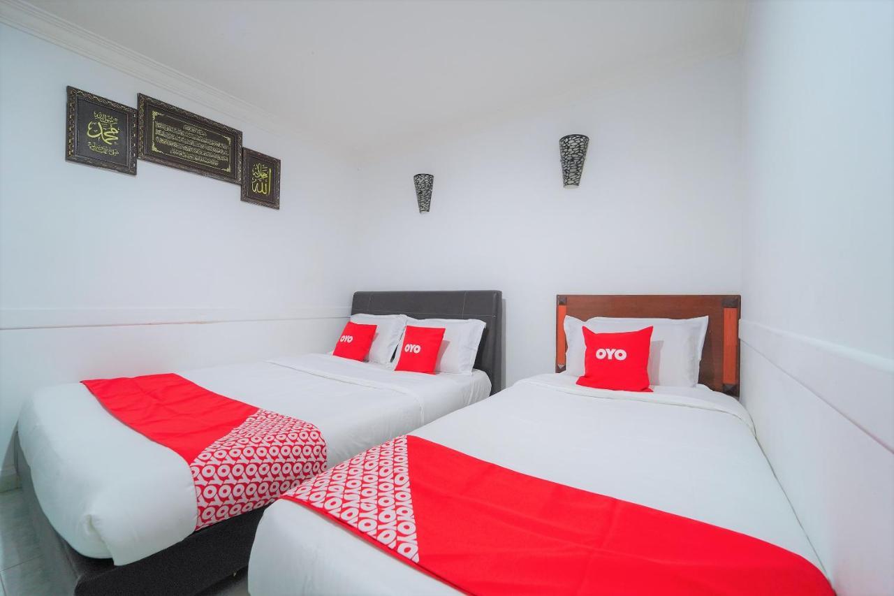 Oyo 89850 Mutiara Motel Куах Экстерьер фото
