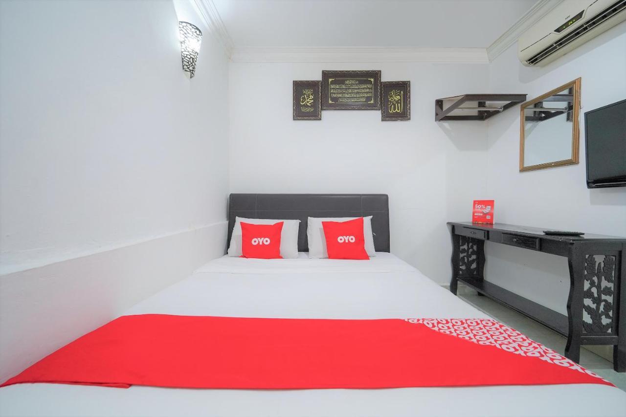 Oyo 89850 Mutiara Motel Куах Экстерьер фото